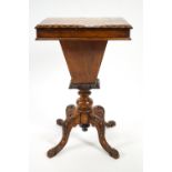 A Victorian walnut games/sewing table with patquetry chequer board top on four carved cabriole legs,