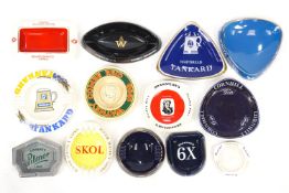 A collection of advertising pub ashtrays, including White Horse Scotch Whiskey, Whitbread,