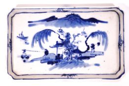 A Chinese porcelain spoon tray, painted in underglaze blue with figures in a landscape, 17cm x 10.