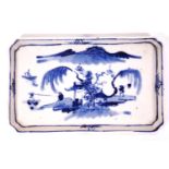 A Chinese porcelain spoon tray, painted in underglaze blue with figures in a landscape, 17cm x 10.