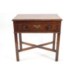 A George III mahogany low boy, with one frieze drawer, square legs linked by X stretchers,