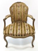 A late 19th century gilt wood elbow chair in the Louis XVI style