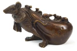 A Japanese bronze figure of a rat pulling a hotei sack covered in it's young,