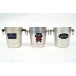 Three champagne buckets, each with two ring handles and labelled Moet & Chandon,