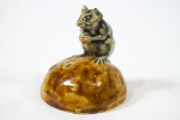 A Royal Doulton 'Lambeth' George Tinworth figure of a green glazed mouse on a bun,