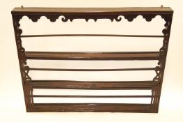 A late 19th century oak and pine plate rack,