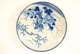 An early 20th century Japanese porcelain charger painted in underglaze blue