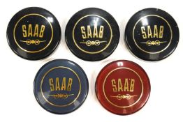 Five coloured Saab fuel caps