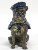 A Victorian cold painted inkwell in the form of a Bulldog, his cap titled H M S Renown,