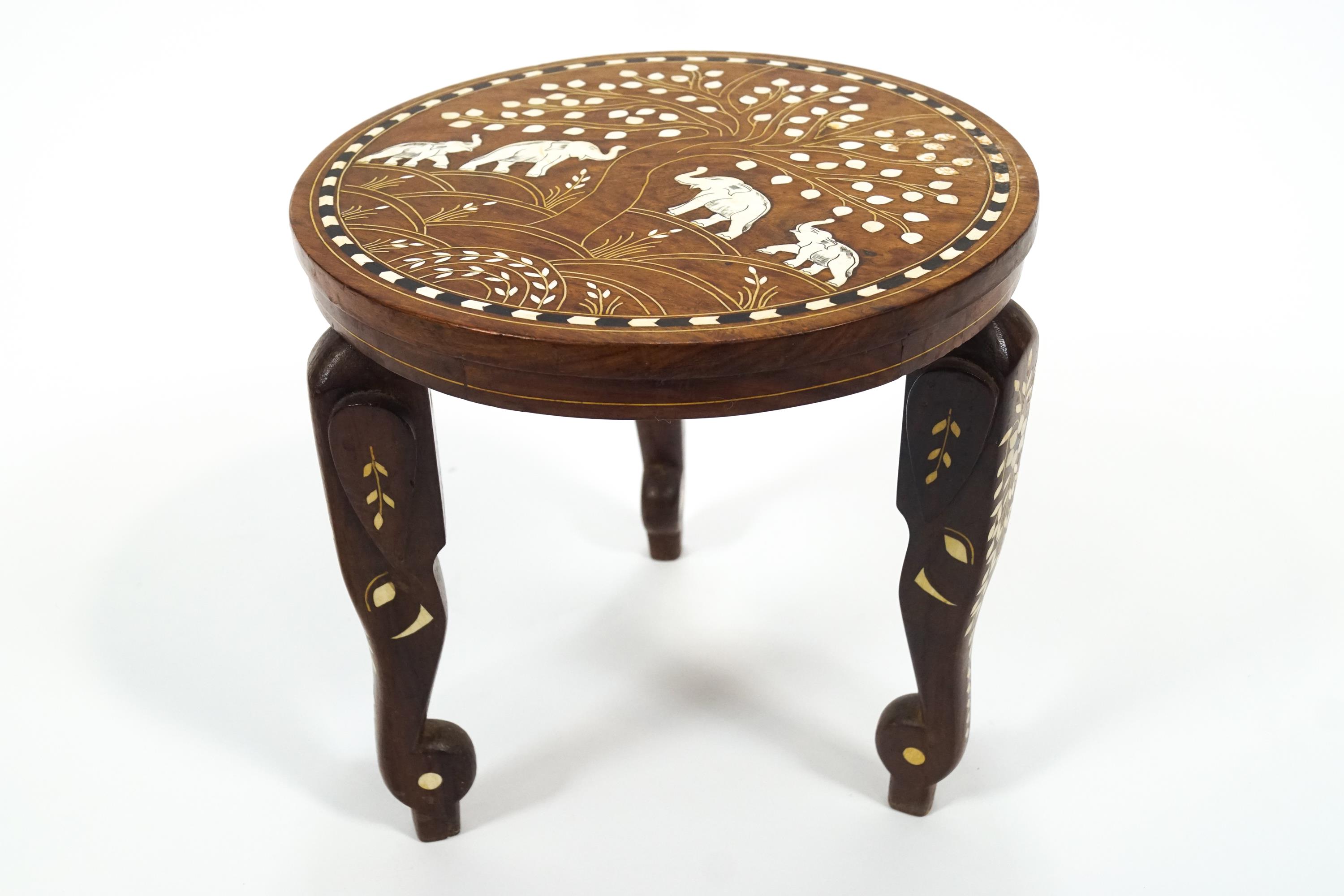 An Indian teak coffee table inlaid with camel bone and ebony with a central panel of the Taj Mahal