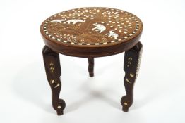 An Indian teak coffee table inlaid with camel bone and ebony with a central panel of the Taj Mahal