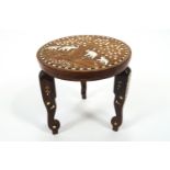 An Indian teak coffee table inlaid with camel bone and ebony with a central panel of the Taj Mahal