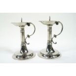 Two pewter pricket candlesticks by A E Williams, in the Tudor style,