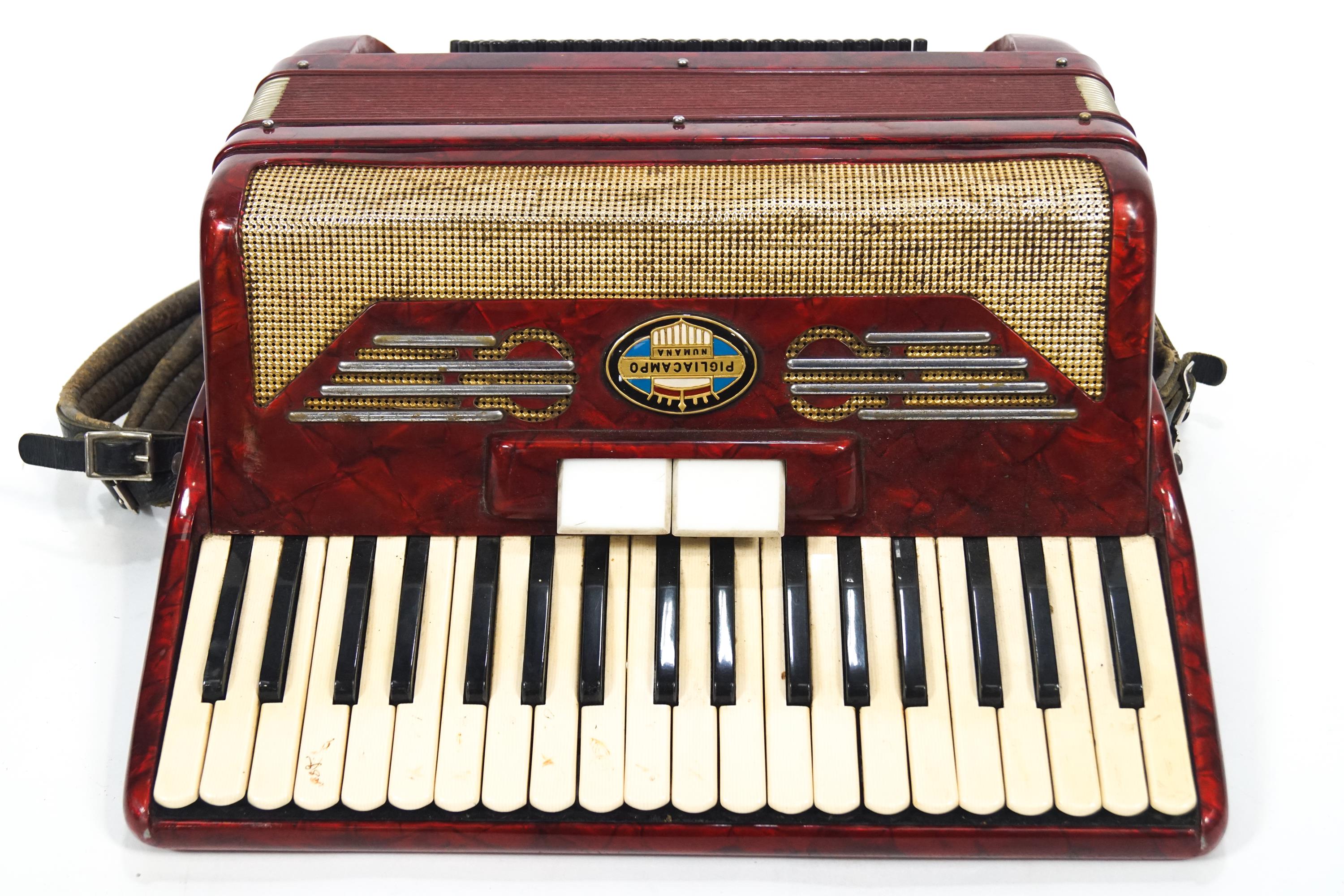 A red Pigliacampo piano accordian,