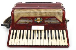 A red Pigliacampo piano accordian,