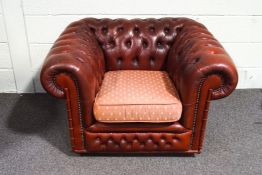 Ar ed leather Club style deep buttoned armchair with loose cushion,