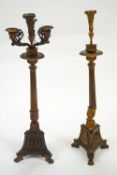 A pair of gilt finished metal candle stands with a central sconce and five branches