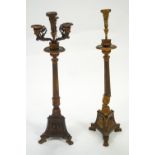 A pair of gilt finished metal candle stands with a central sconce and five branches