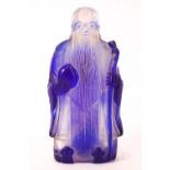 A clear glass with blue overlay Chinese snuff bottle in the form of a sage,