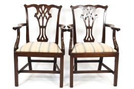 A pair of 19th century mahogany elbow chairs with pierced interlinked splats,
