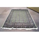 A green ground Bokhara carpet,