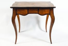 A 19th century French centre table with shaped rectangular marquetry top on a birds eye maple
