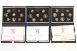 Three de luxe coin sets,
