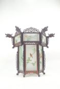 A Chinese carved hardwood and acid etched glass hexagonal pendant light shade with pierced cresting