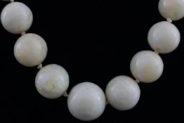 A single strand of graduated opal beads, consisting of 44 round polished beads measuring from 7.