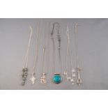 A collection of six silver necklaces of variable designs.