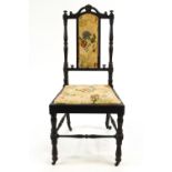 A Victorian solid ebony nursing chair,