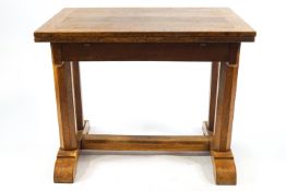 An oak Cotswold style extending dining table on column supports and splayed base ,