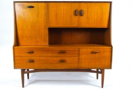 A G plan teak sideboard, of plain rectangular form with raised top,