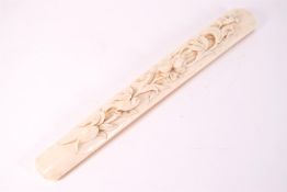 A Victorian ivory handle, carved with flowers and a bird,