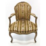 A late 19th century gilt wood elbow chair in the Louis XVI style