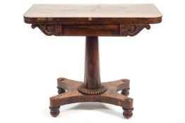 A nineteenth century rosewood pedestal card table on a quadriform base,