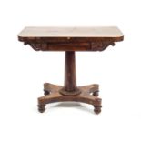 A nineteenth century rosewood pedestal card table on a quadriform base,