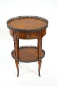 A French style walnut two tier etagere with pierced metal gallery above one frieze drawer