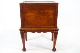 A hardwood two handled chest on stand with carved cabriole legs with ball and claw feet, 89.