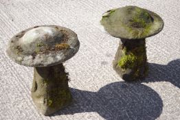 A pair of composition staddle stones,