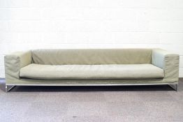 A B&B Italia Solo sofa with chrome supports and green upholstery,