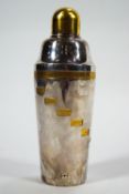 A silver plate and gilt 'Tells-u-How' cocktail shaker, for fifteen beverages,