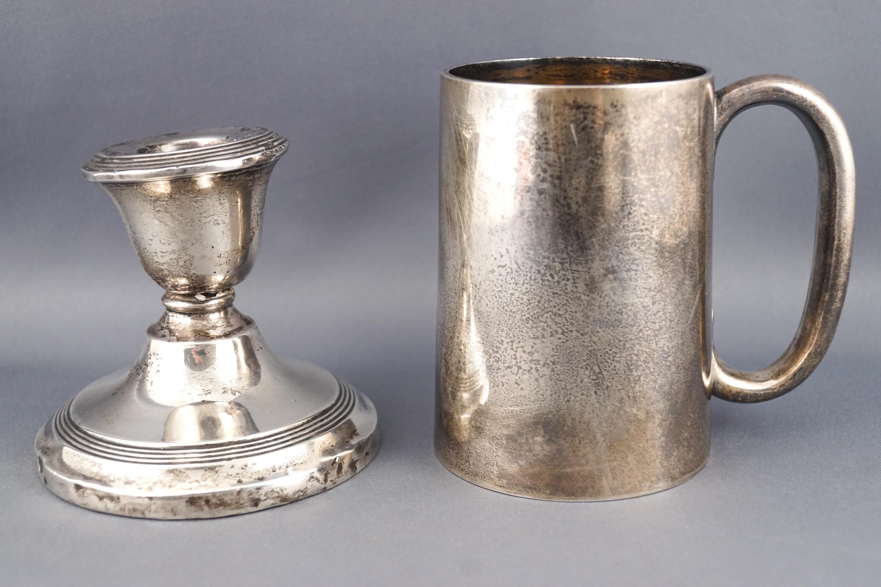 A plain silver cylindrical tapered mug, London 1920, 9cm high, 172 grams,