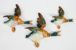 A set of three Beswick flying mallards,