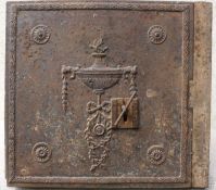 An 18th century style wall safe and key, the front cast with Adam style urn and patera,