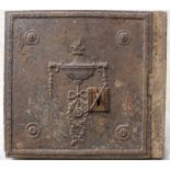 An 18th century style wall safe and key, the front cast with Adam style urn and patera,