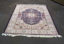 A blue ground Kohan rug,