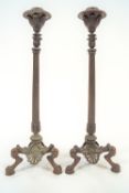 A pair of 19th century bronze candlesticks, of classical form,