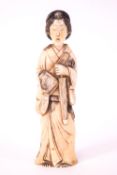 An early 20th century Japanese ivory figure of a lady,