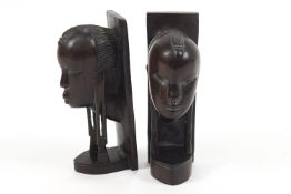 A pair of African carved ebony tribal bookends in the form of ladies with attenuated ear lobes,